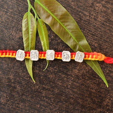 Elegant Silver Om Rakhi for Auspicious Bond