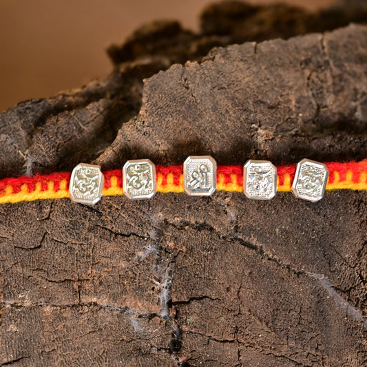Elegant Silver Om Rakhi for Auspicious Bond