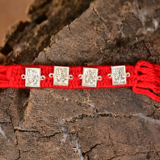 Traditional Silver Ganesh Rakhi on Red Thread
