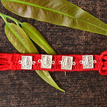Traditional Silver Ganesh Rakhi on Red Thread